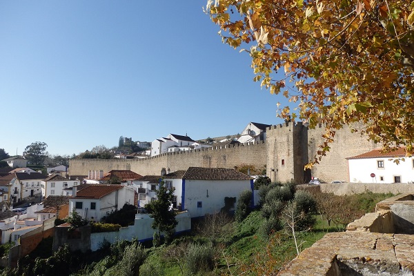 Wondering what to see in Óbidos? Don't miss the medieval walls that circle the town!